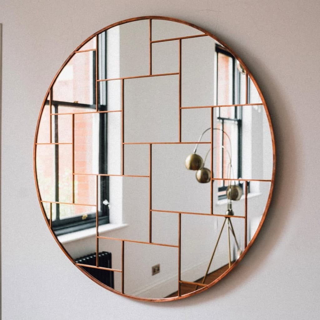 Rotation Mirror, Twenty-six hand-cut facets set in solid copper.